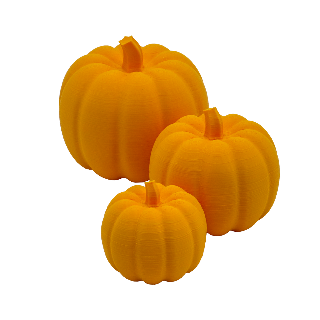 Drei 3D-Kürbisse in verschiedenen größen in der Farbe Orange